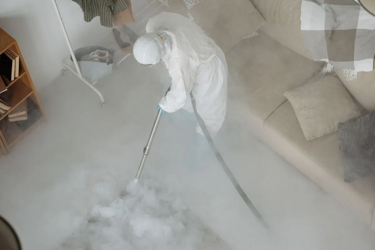 Biohazard cleanup technician in protective equipment, Sylvan Lake, MI